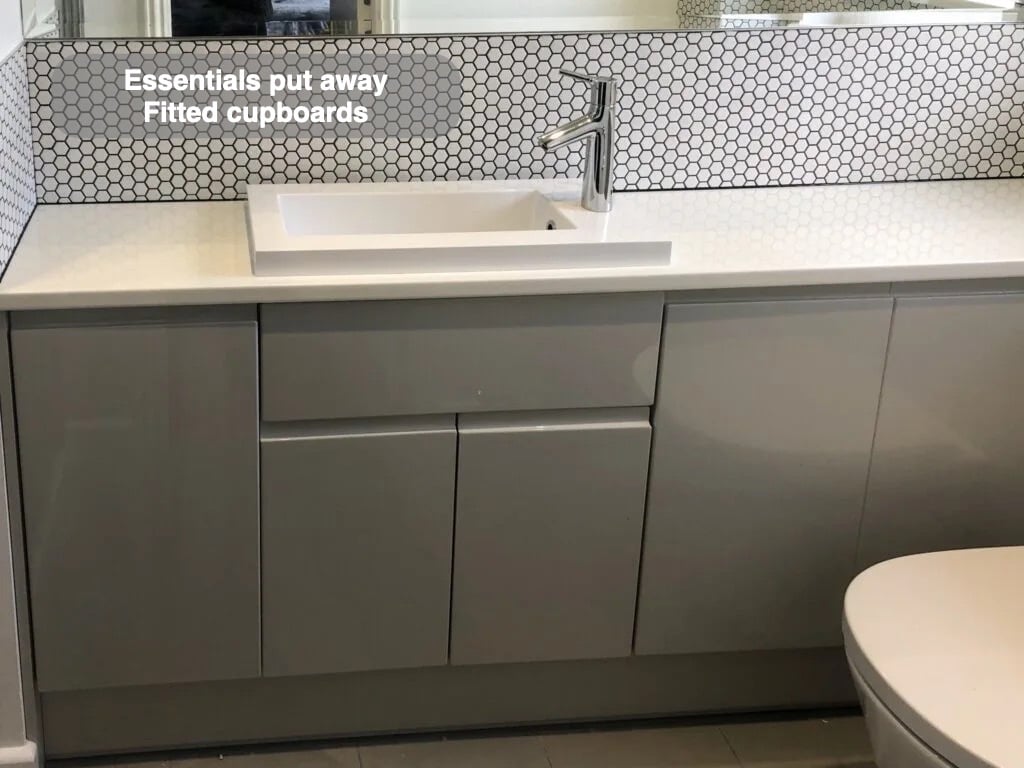 Storage close to the basin in the completed Westhill bathroom