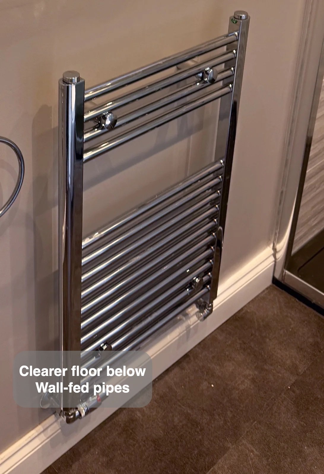 Towel radiator with pipework through wall