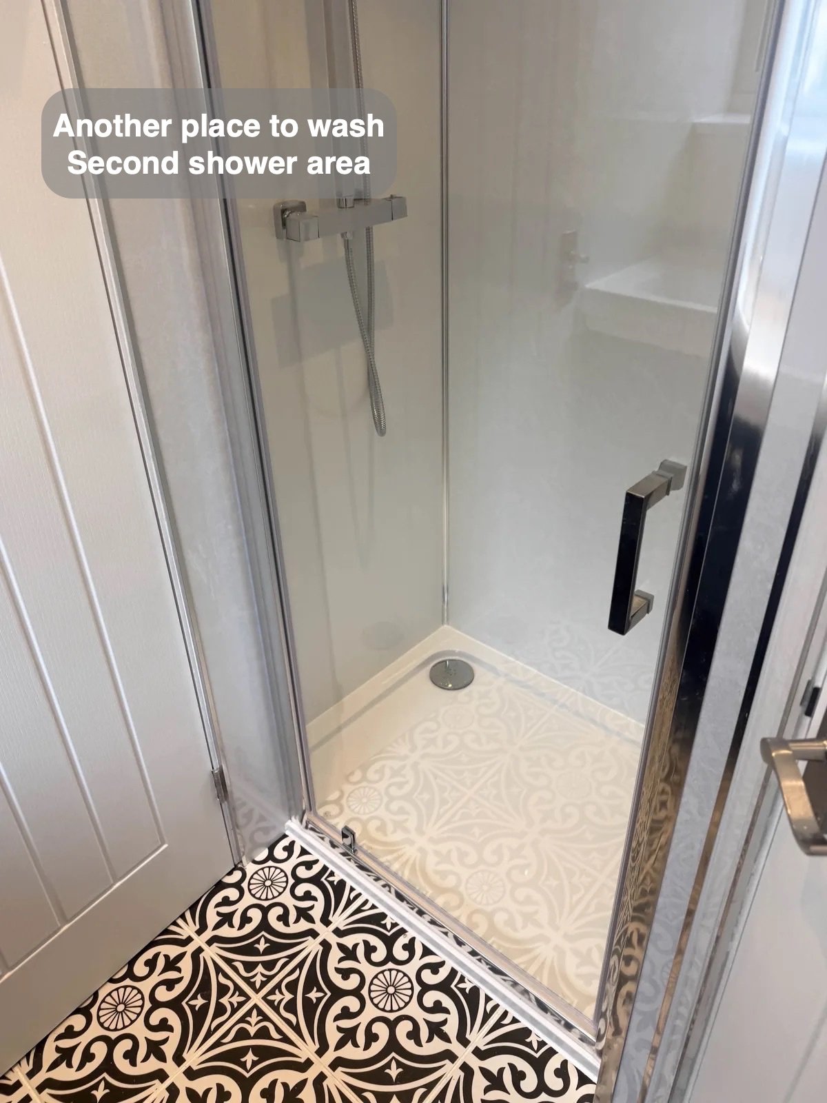 Shower tray and patterned tiled floor