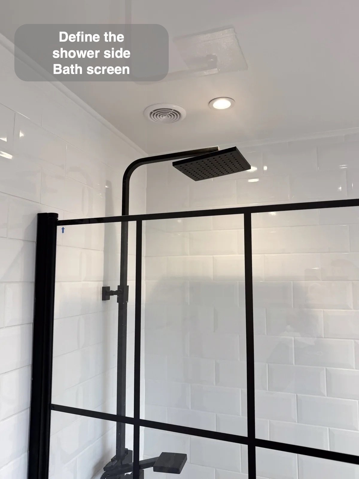 Grid bath screen below overhead shower