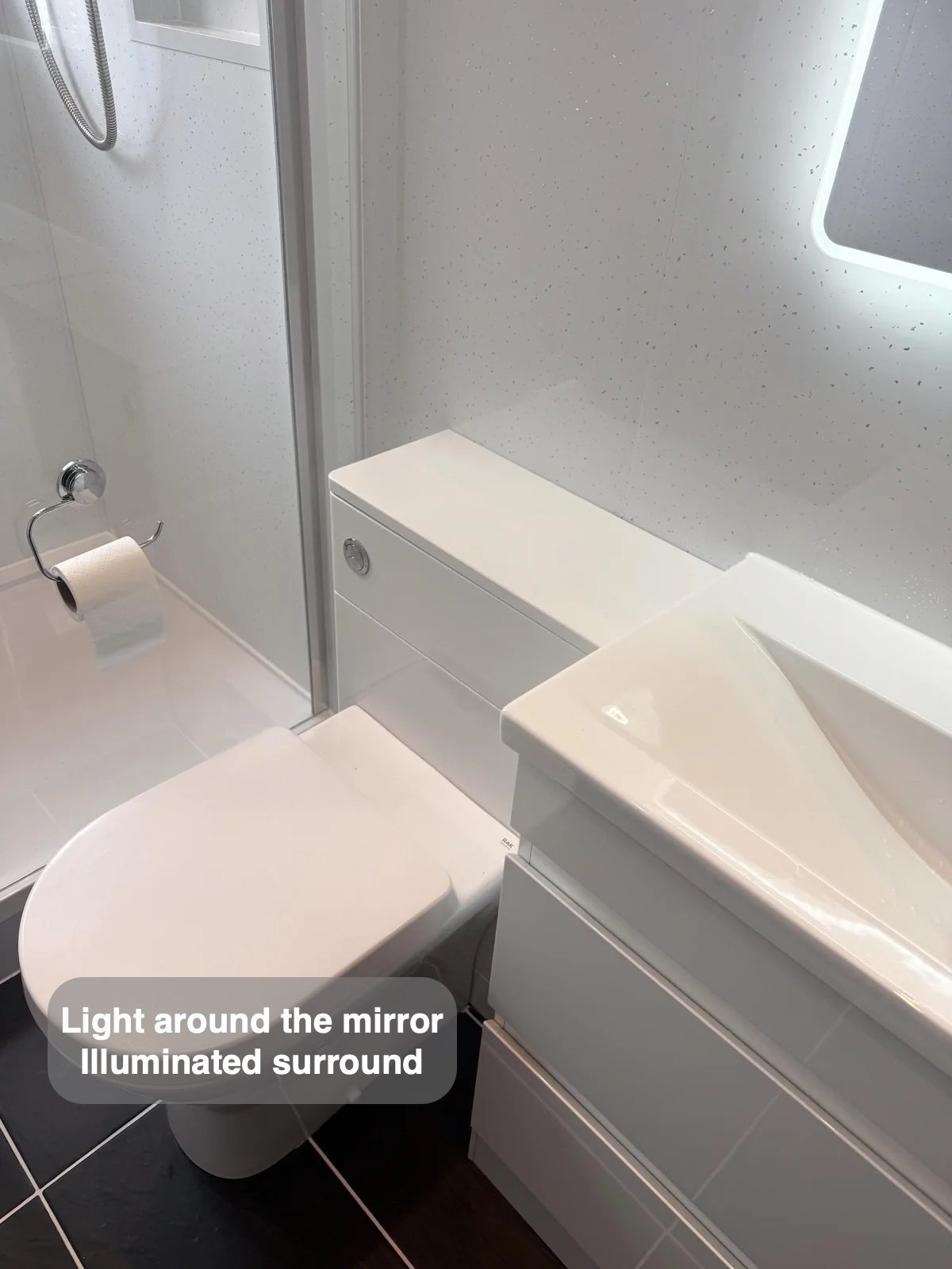 Basin beneath LED mirror