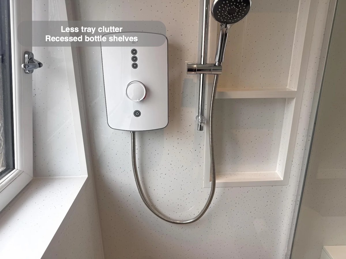 Handset beside built-in shower recess