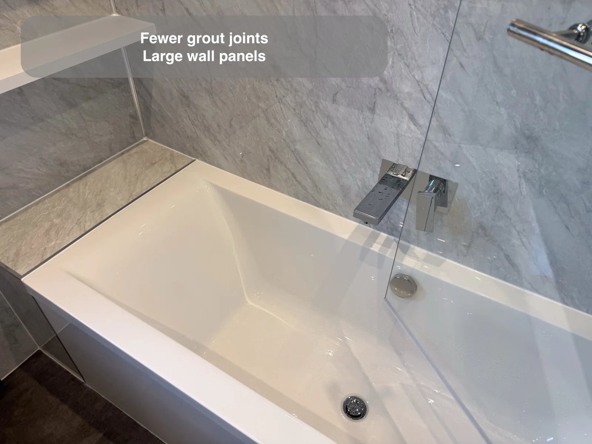 Panelled bath area and wall-mounted filler
