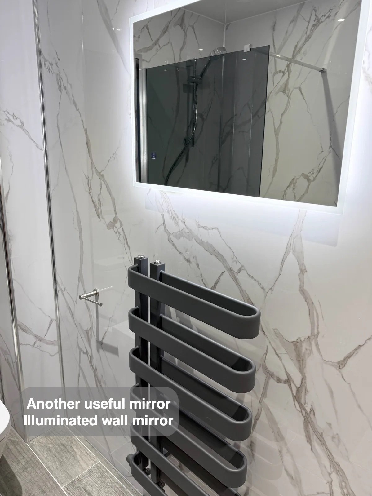 LED mirror above towel radiator