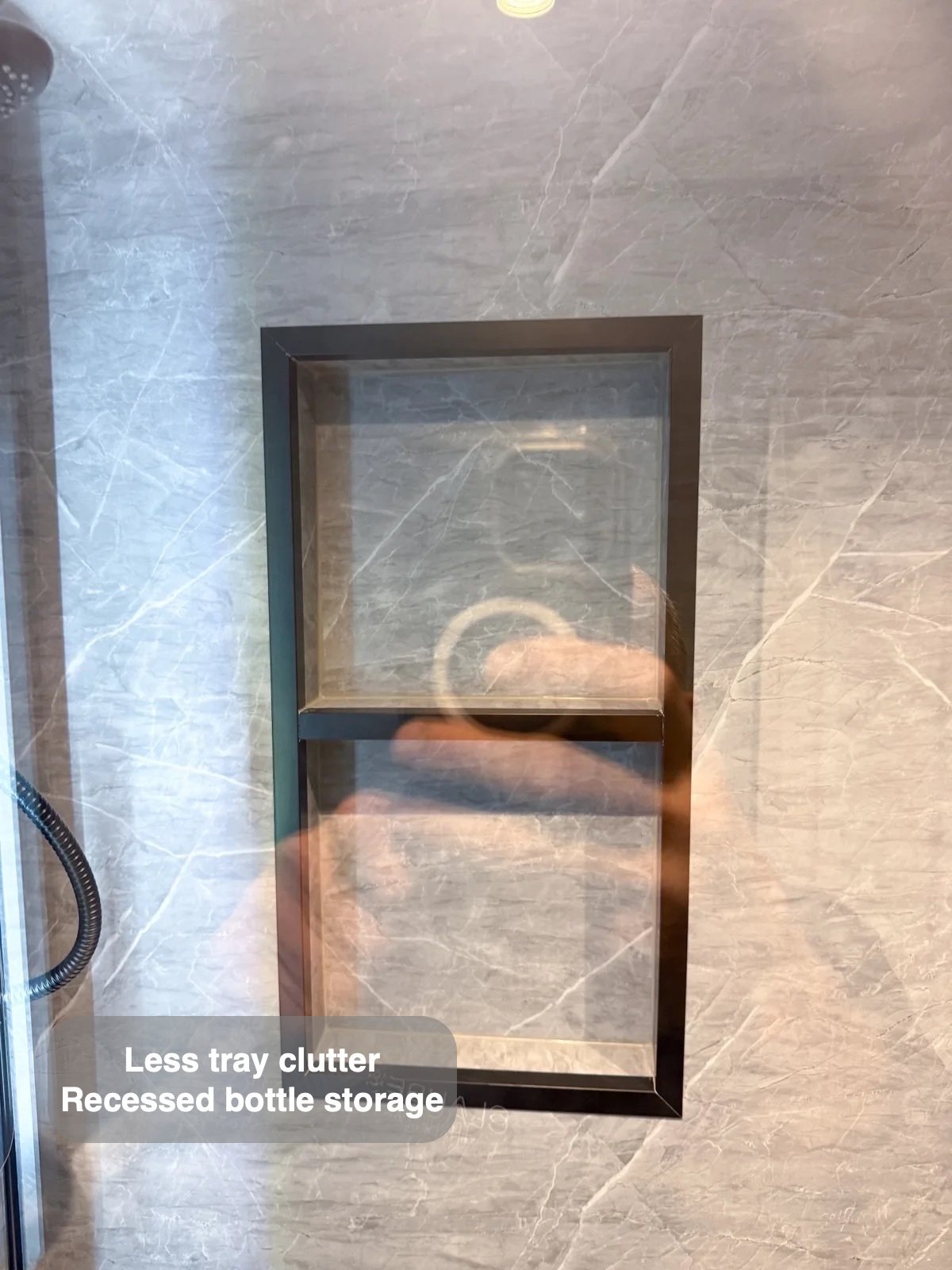 Two recessed shelves in shower wall