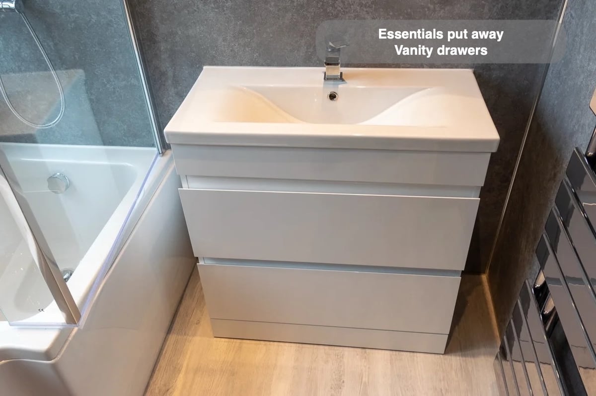 Storage close to the basin in the completed West End, Aberdeen bathroom