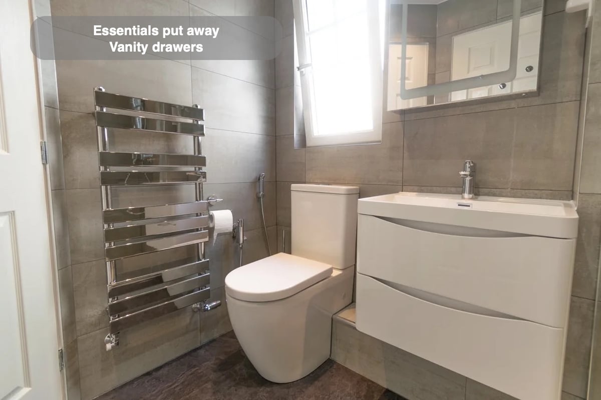 Storage close to the basin in the completed Westhill bathroom