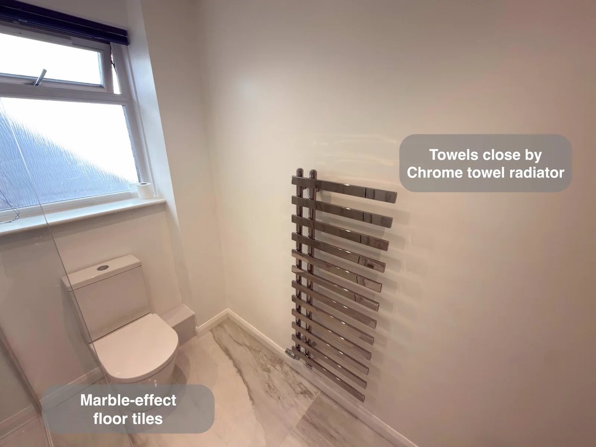 Towel radiator and tiled floor