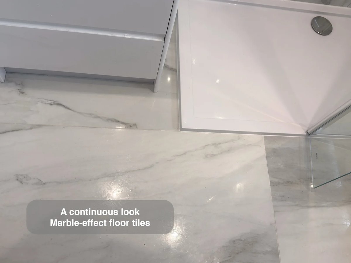 Continuous marble-effect tiled floor