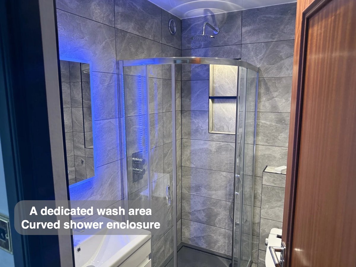 Curved shower enclosure