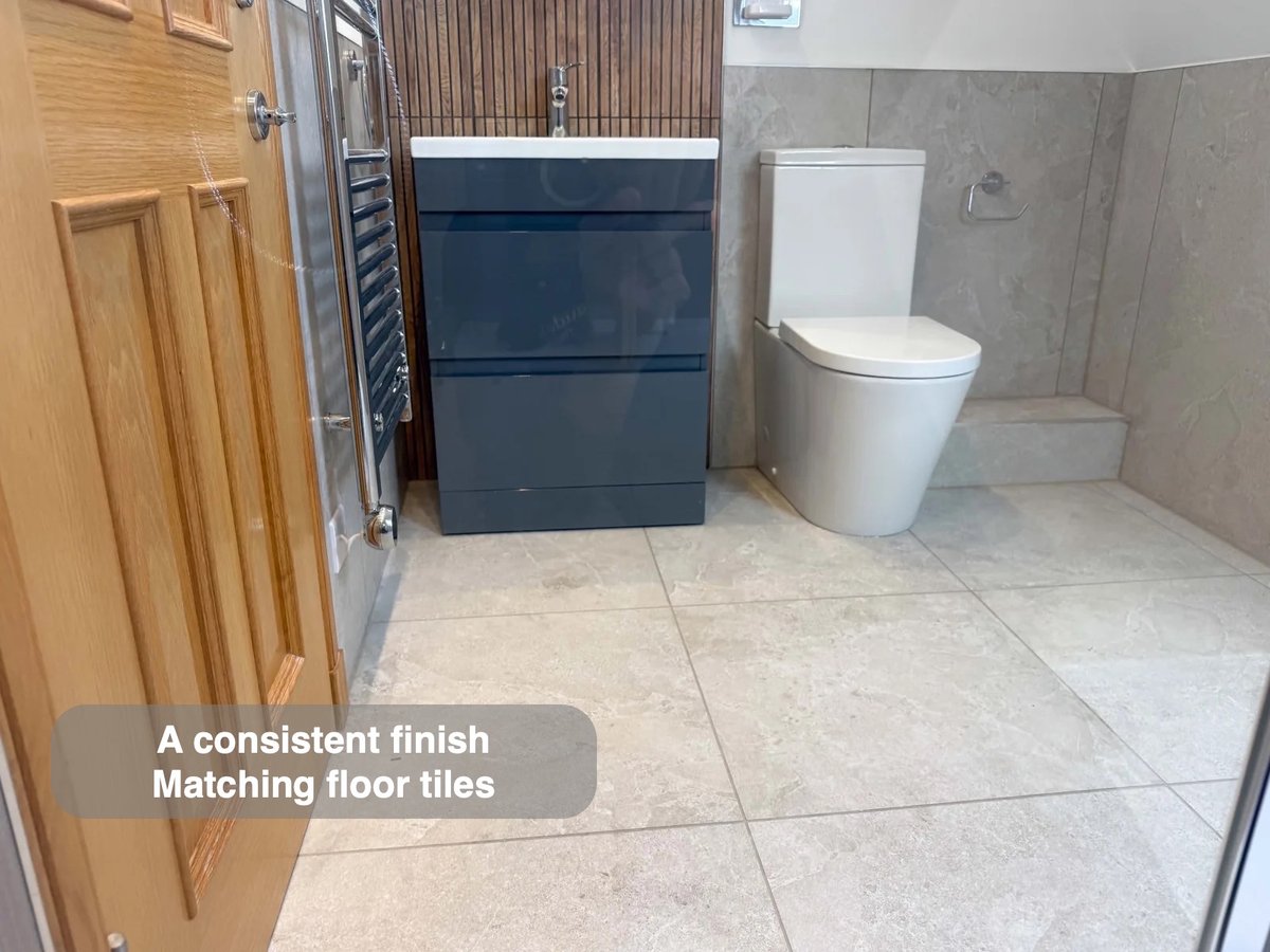 Tiled floor beside blue vanity and toilet