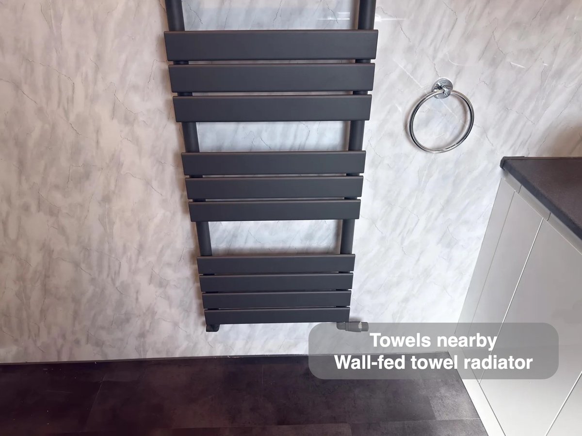Wall-fed towel radiator