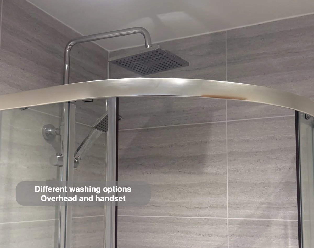 Overhead shower within enclosure