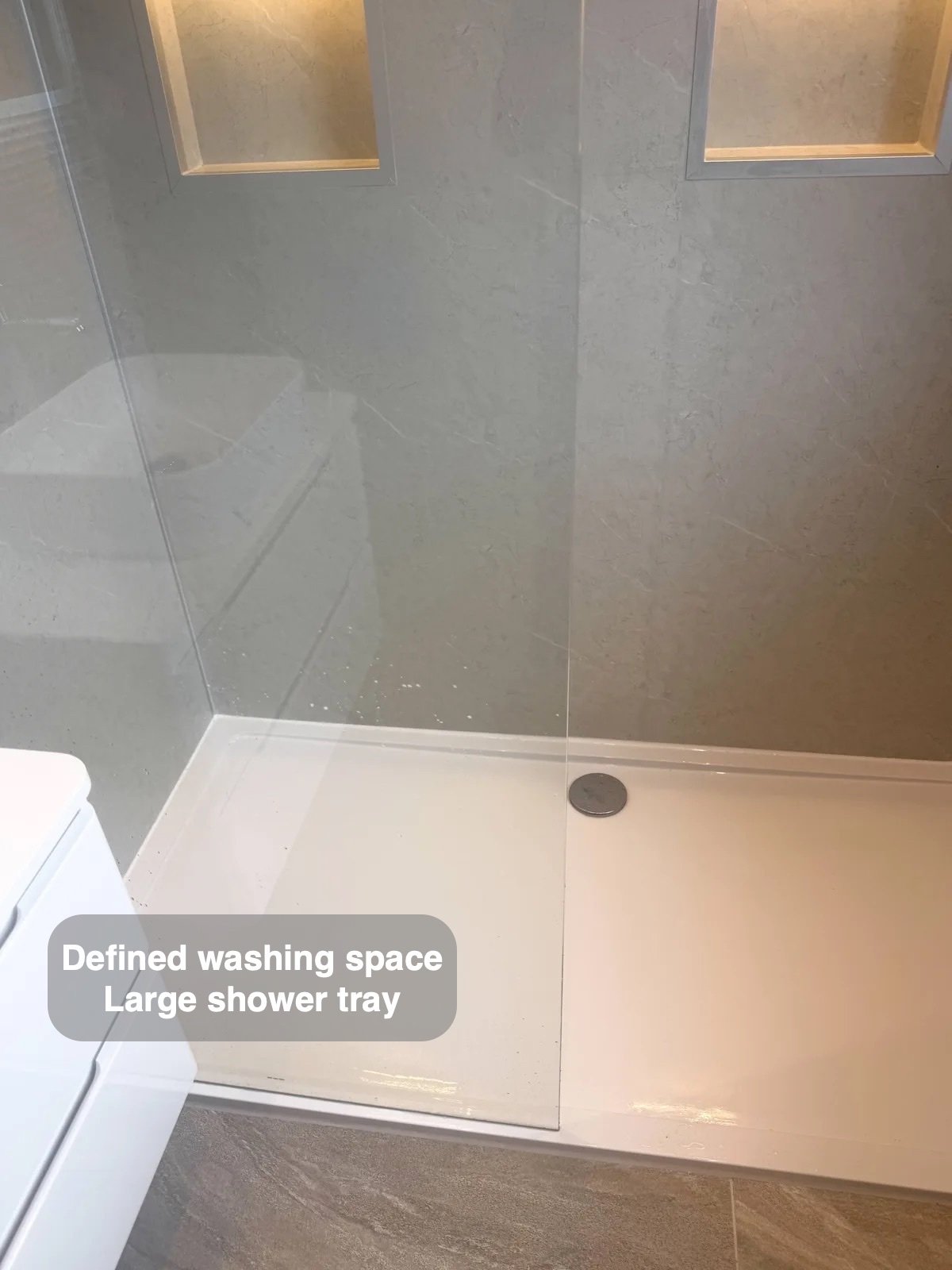 Shower tray behind clear screen