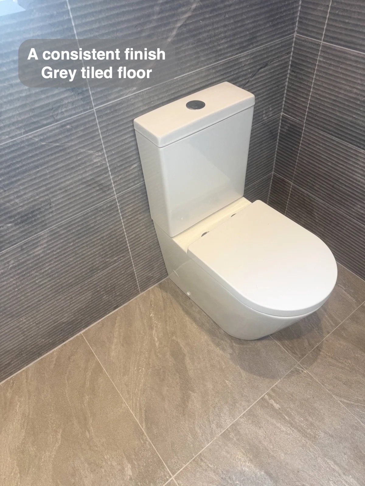 Close-coupled toilet and tiled floor