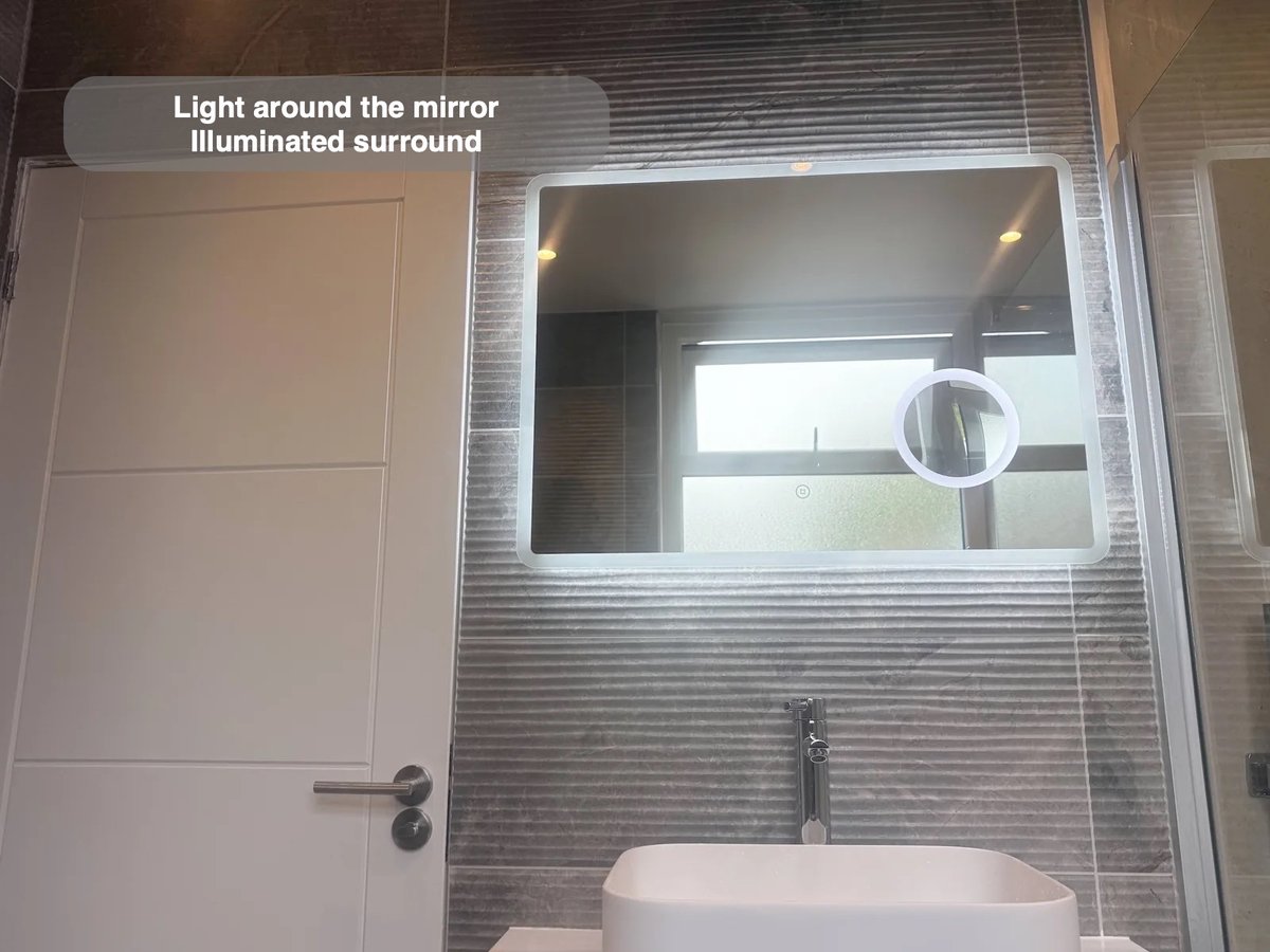 Large LED mirror above basin