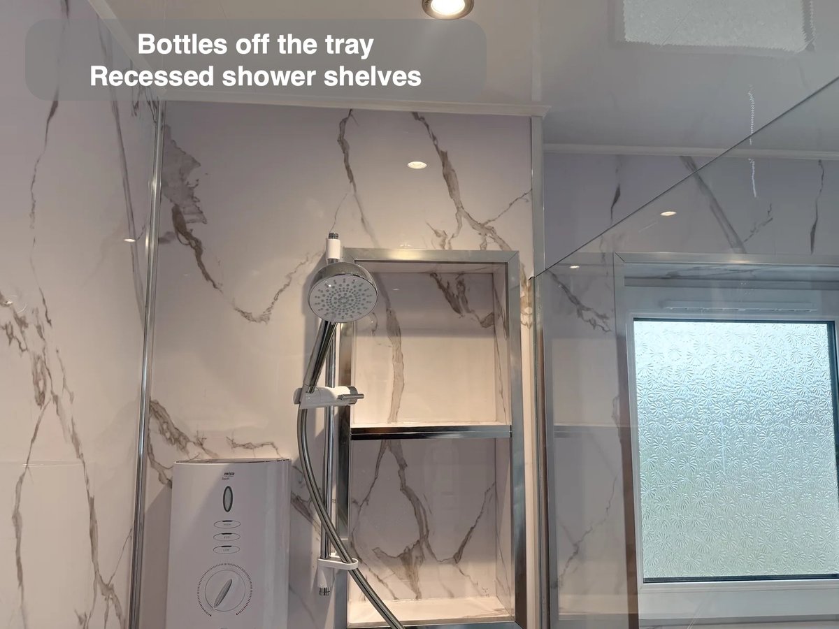 Bottles within the wall in the completed Balmedie bathroom