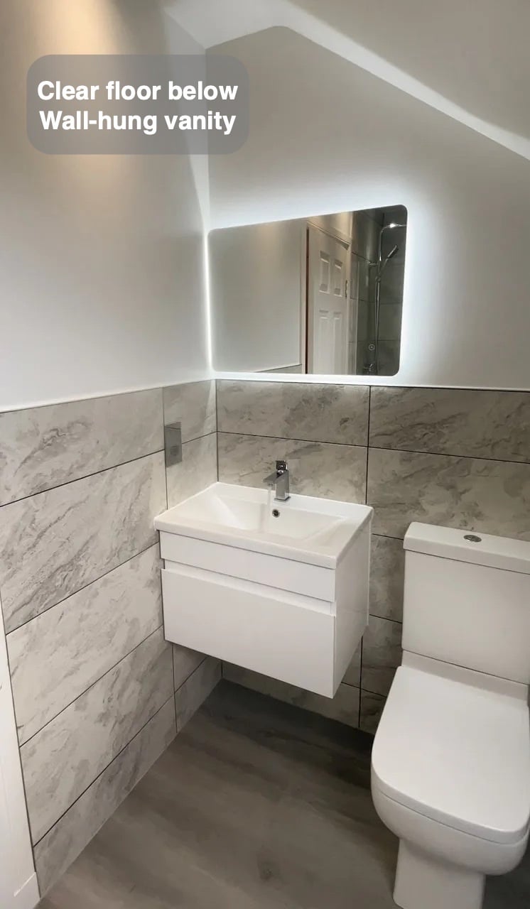A clearer floor beneath the basin in the completed Portlethen bathroom