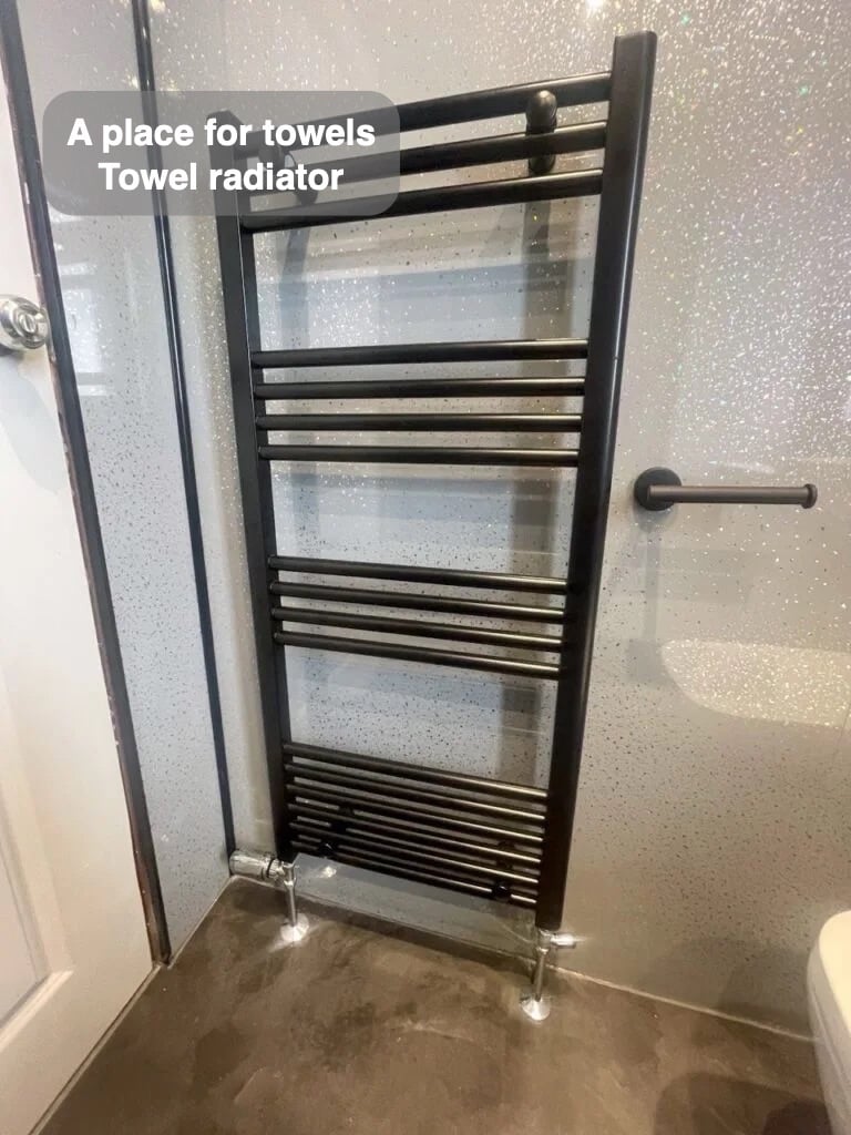 Towels have their own place in the completed Mastrick, Aberdeen bathroom