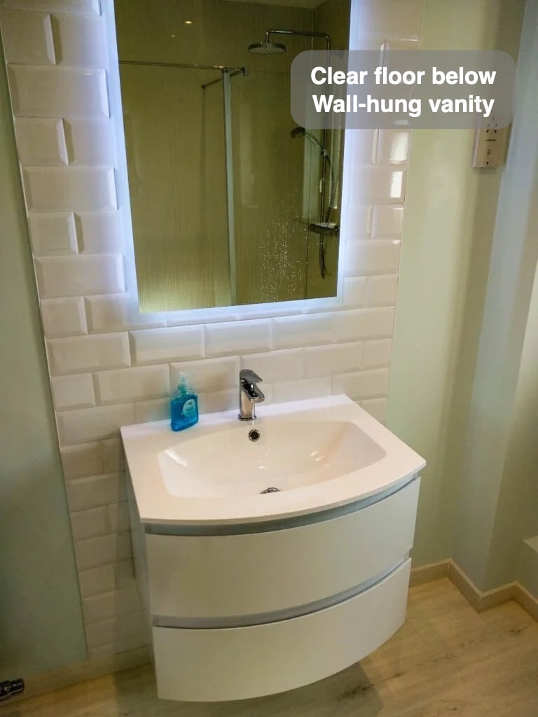 A clearer floor beneath the basin in the completed Stonehaven bathroom