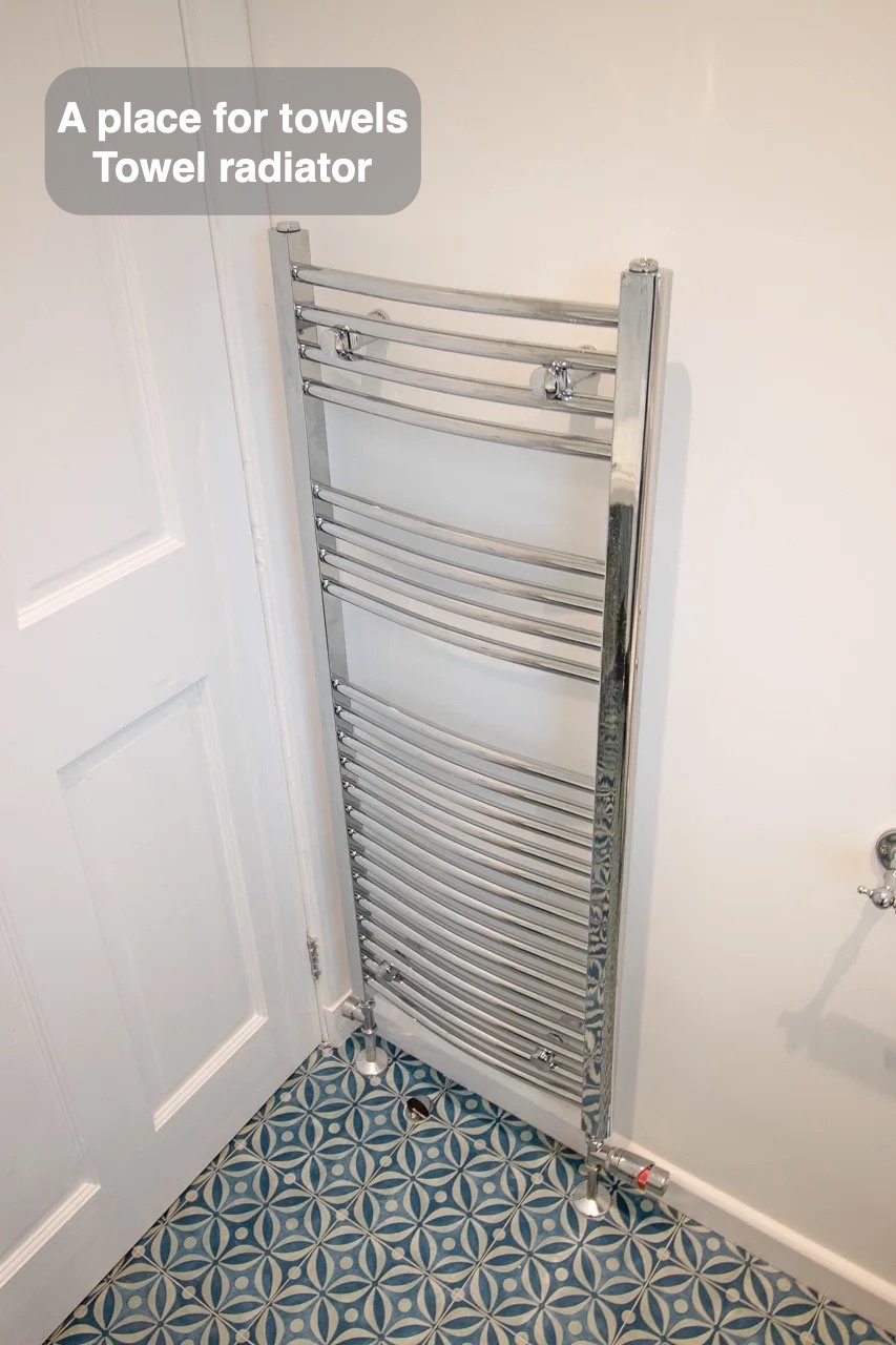 Towels have their own place in the completed Woodside, Aberdeen bathroom