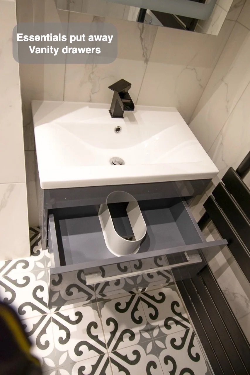 Storage close to the basin in the completed West End, Aberdeen bathroom