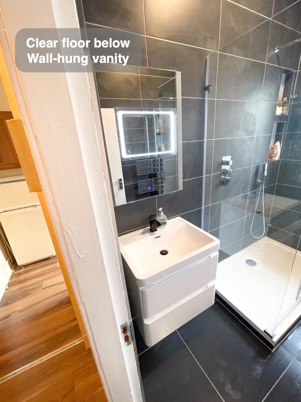 A clearer floor beneath the basin in the completed West End, Aberdeen bathroom
