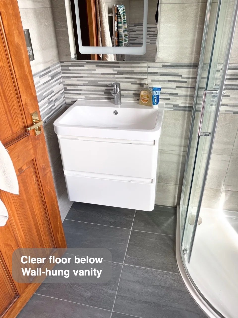 A clearer floor beneath the basin in the completed Woodside, Aberdeen bathroom