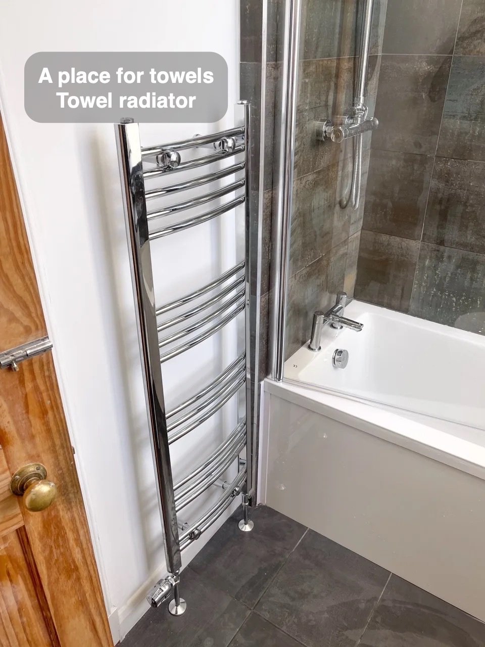 Towels have their own place in the completed Holburn, Aberdeen bathroom