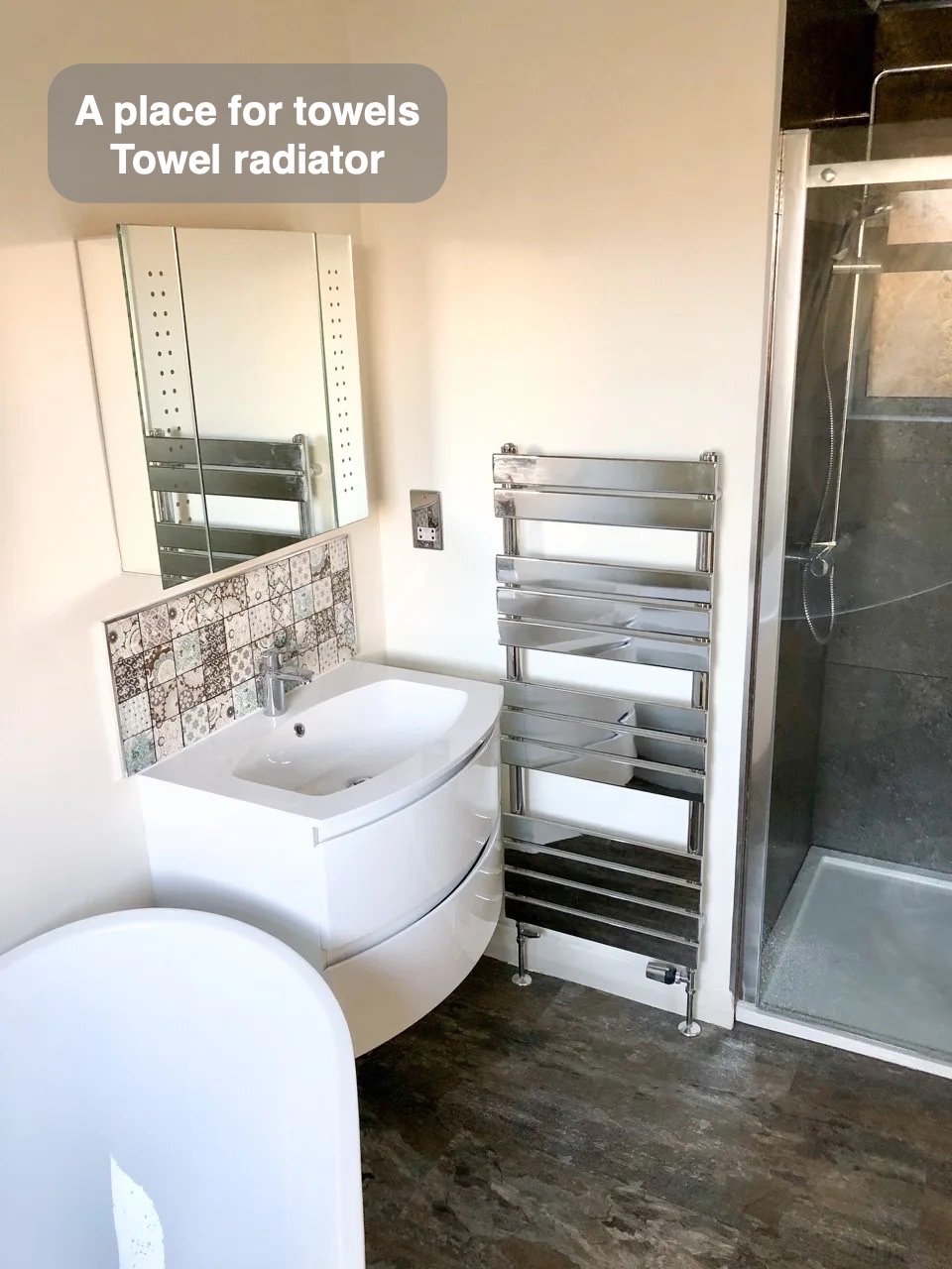 Towels have their own place in the completed Inverurie bathroom