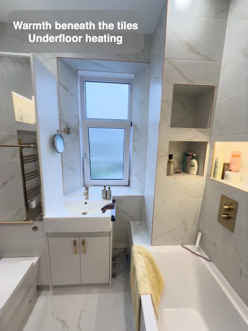 Warmth beneath a coordinated finish in the completed Broomhill, Aberdeen bathroom