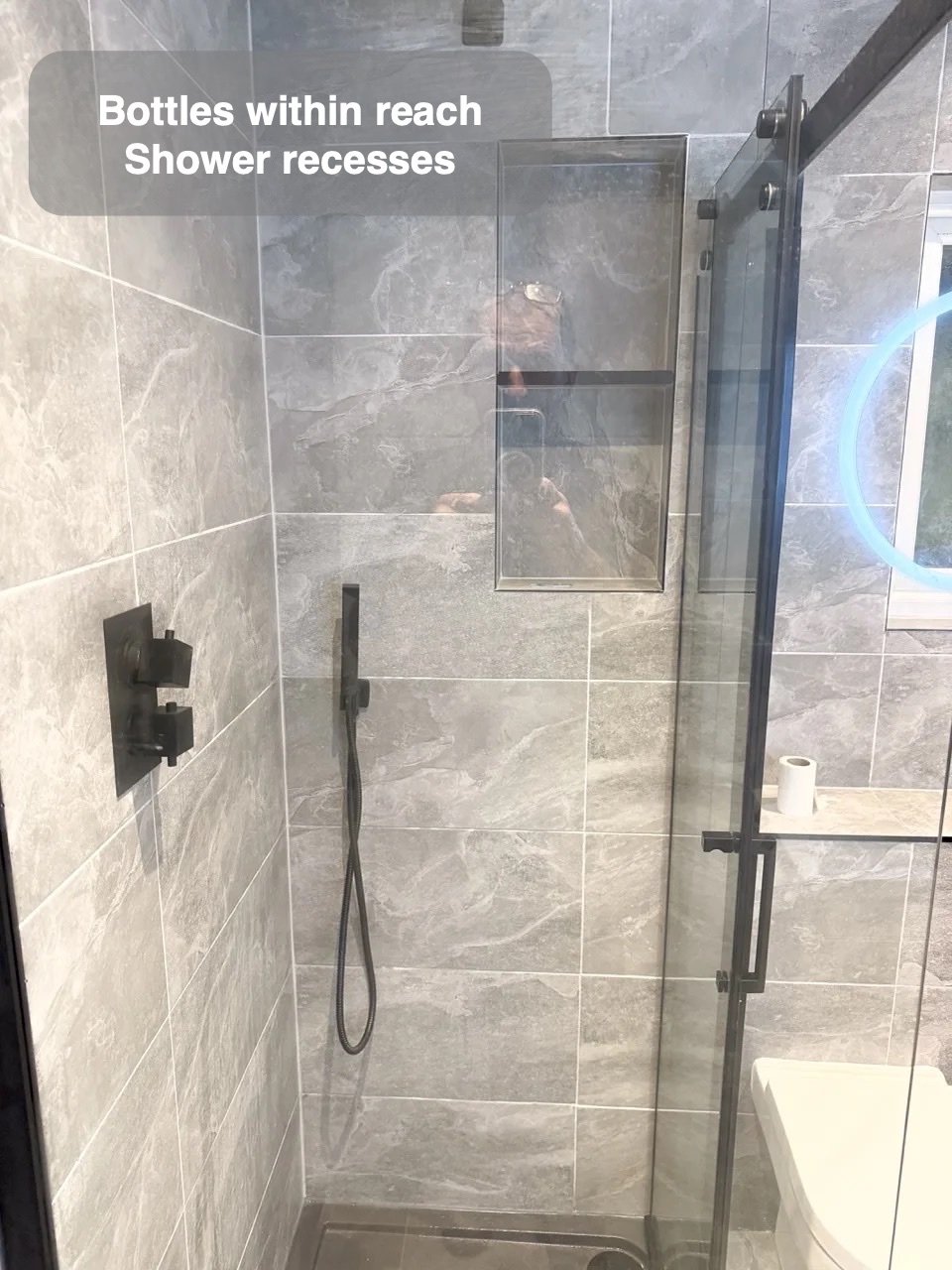 Bottles stored within the shower wall in the completed Bridge of Don bathroom