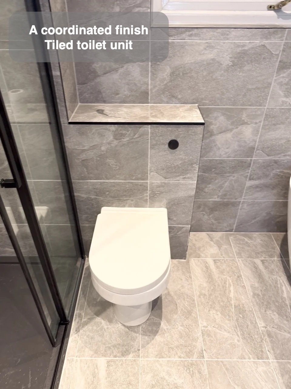 Bottles stored within the shower wall in the completed Bridge of Don bathroom