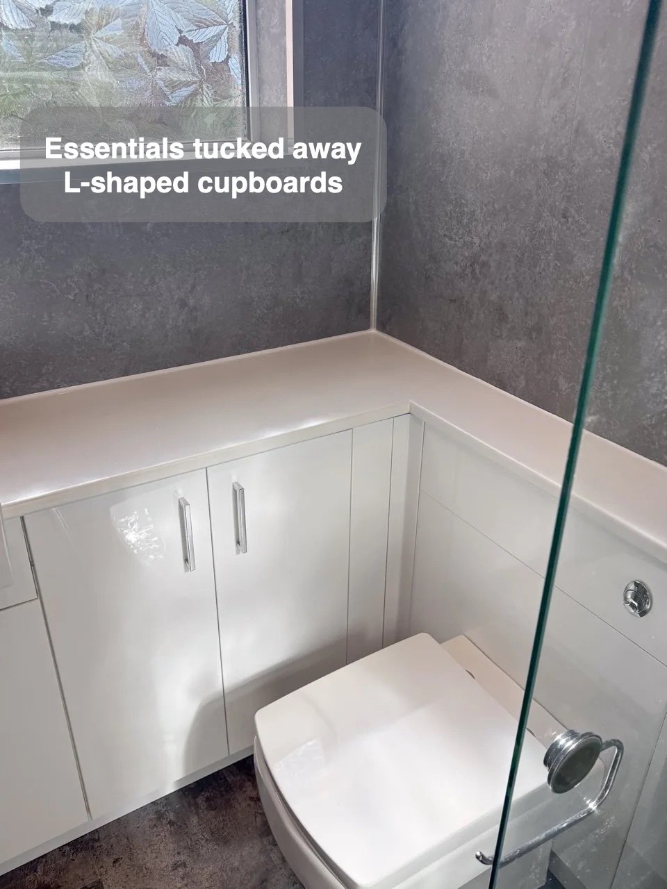 Storage around the corner in the completed Aberdeen bathroom