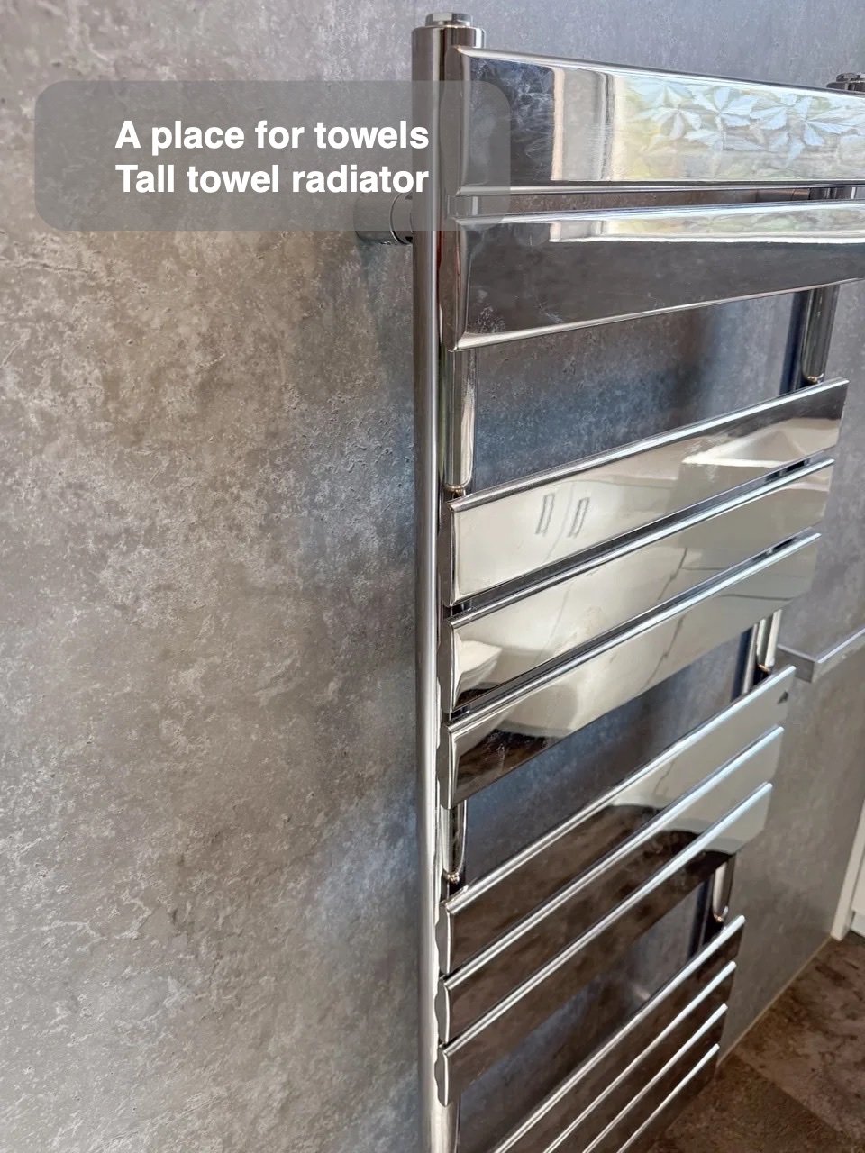 Towels and light close by in the completed Aberdeen bathroom