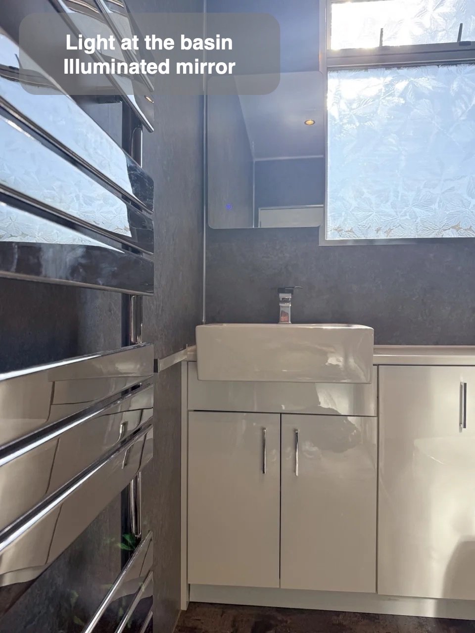 Towels and light close by in the completed Aberdeen bathroom