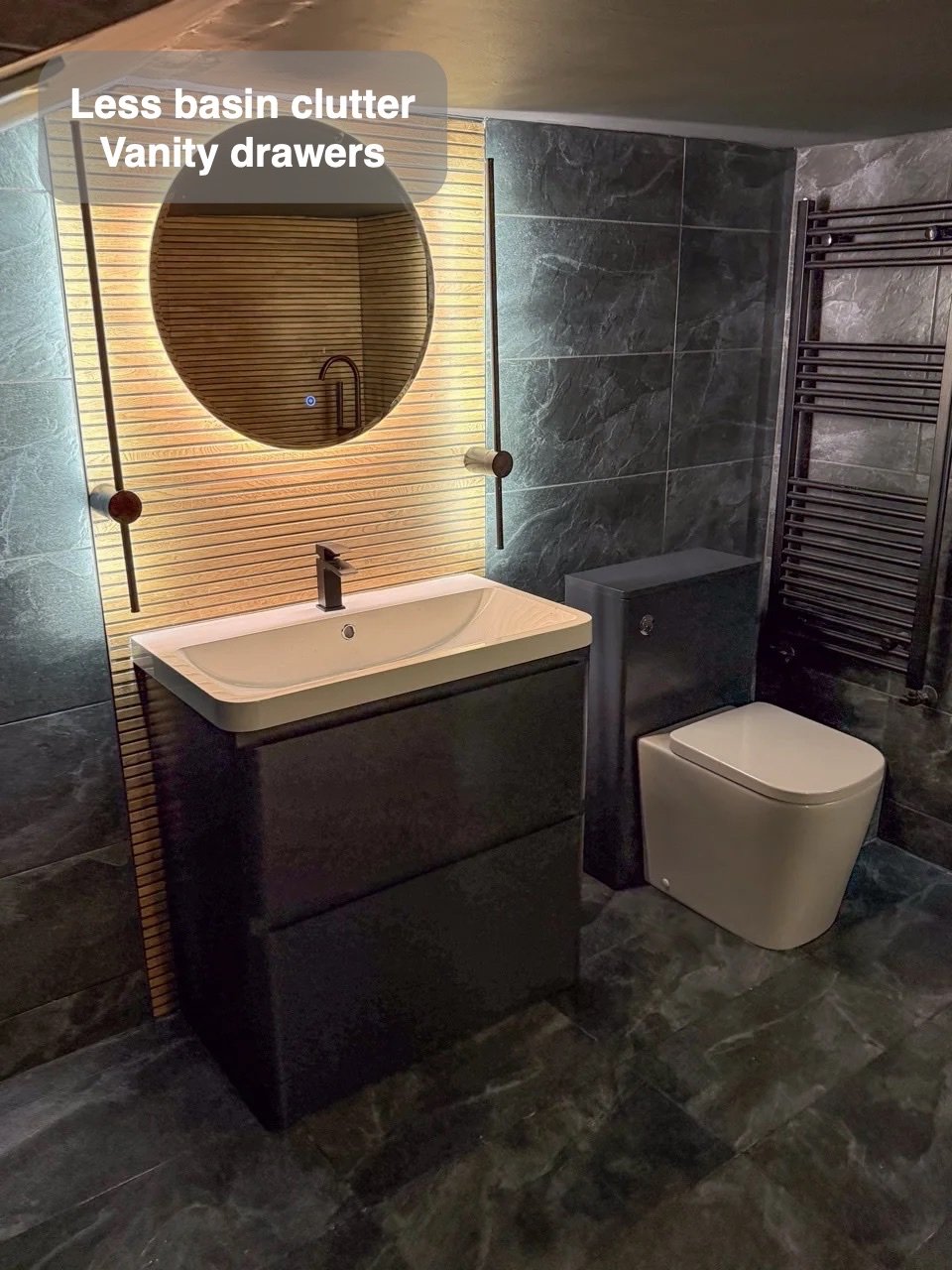 Vanity drawers beside compact back-to-wall toilet
