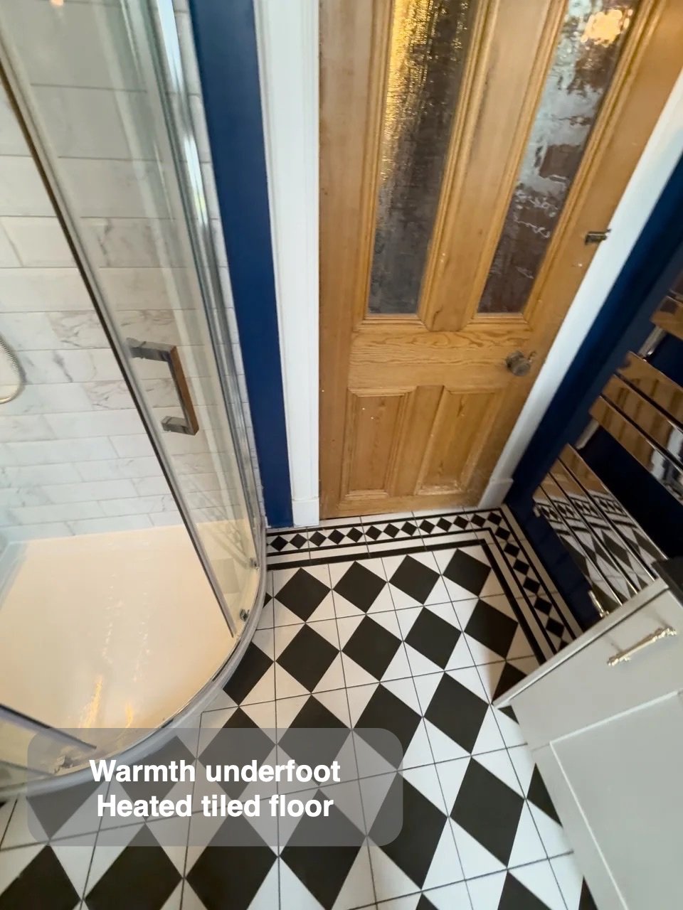 A coordinated floor and shower in the completed Rosemount, Aberdeen bathroom