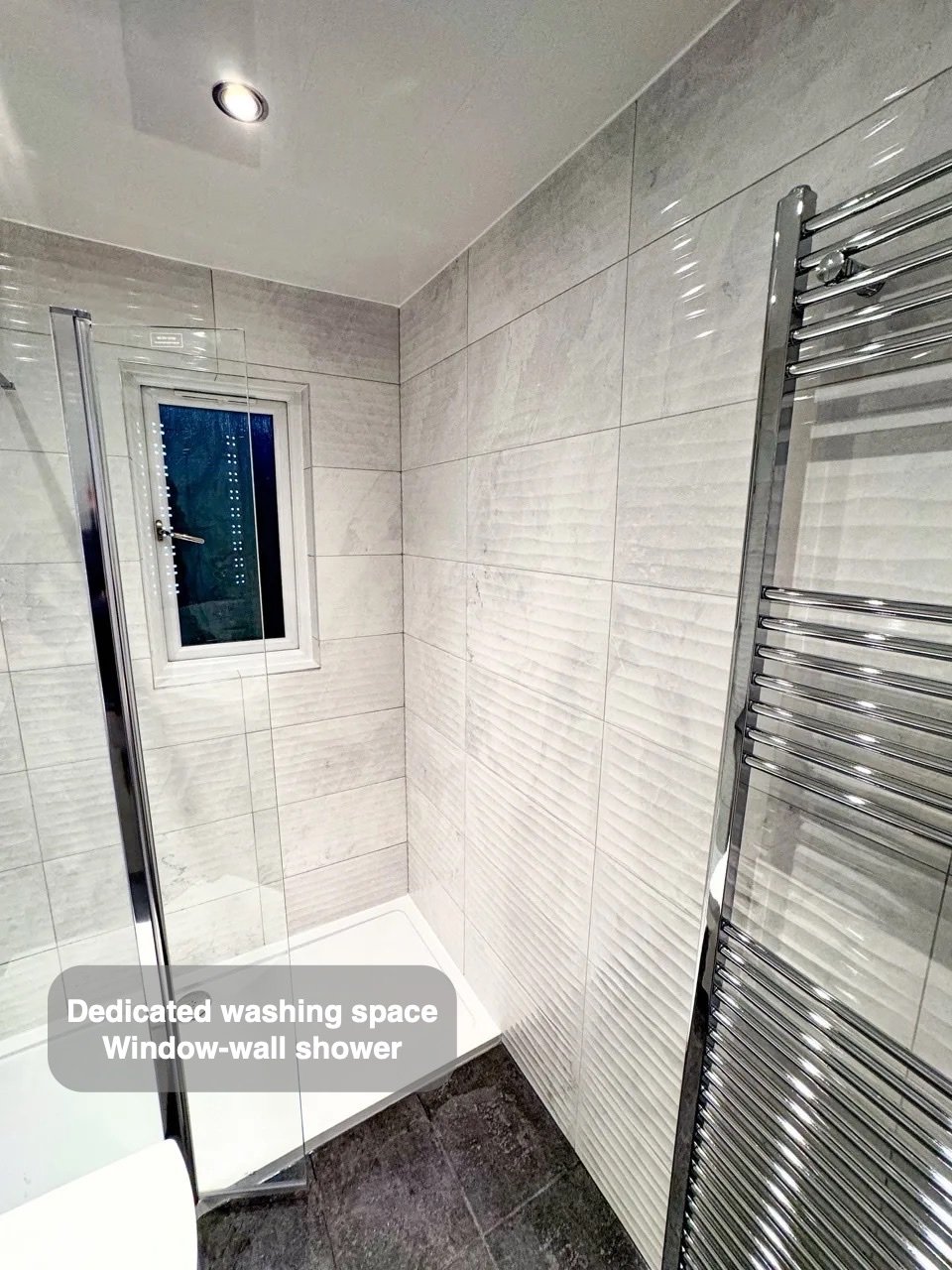 Shower tray beside radiator