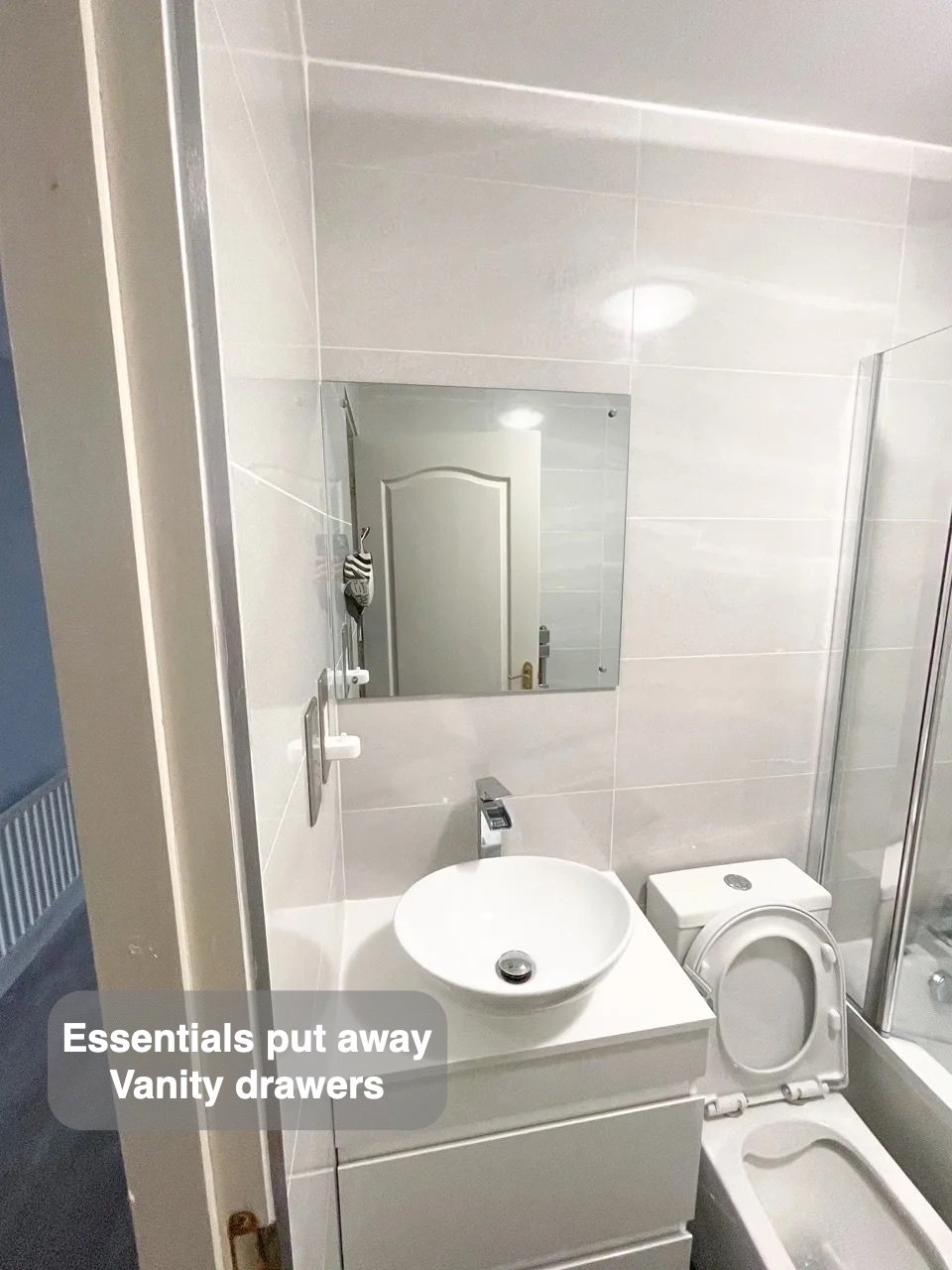 Storage close to the basin in the completed Danestone, Aberdeen bathroom