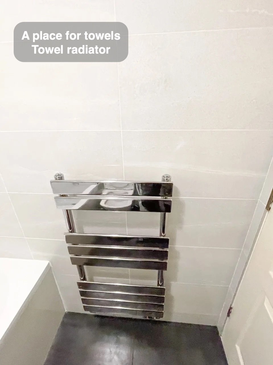 Towels have their own place in the completed Danestone, Aberdeen bathroom