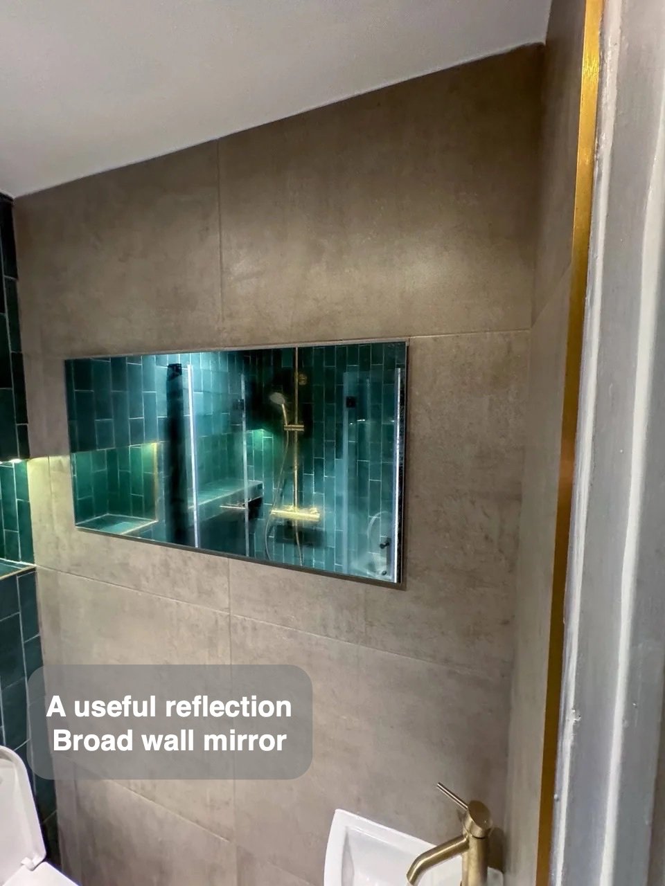Broad wall mirror