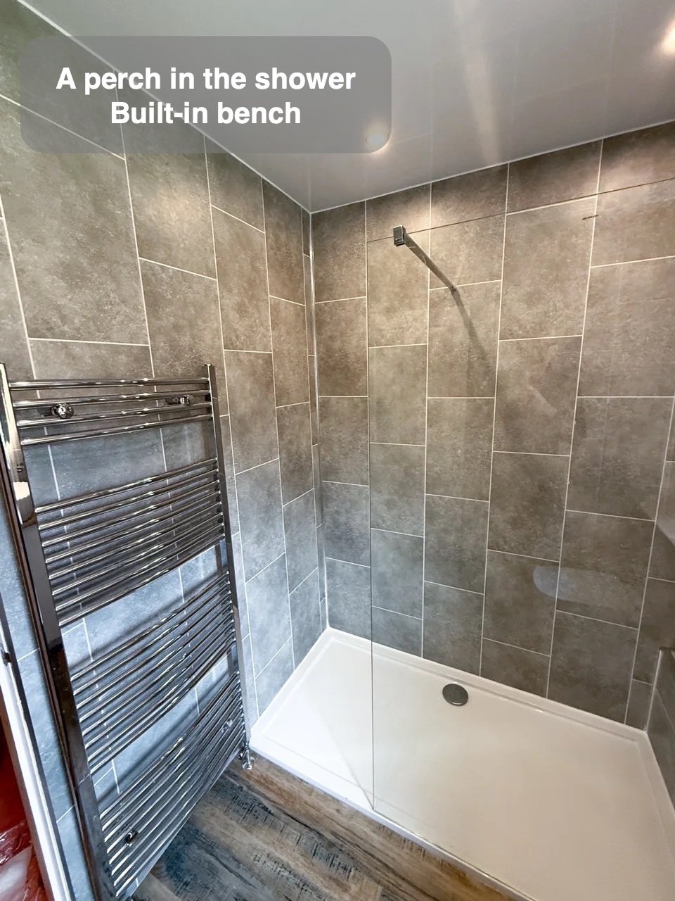 A shower with a place to pause in the completed Aberdeen bathroom