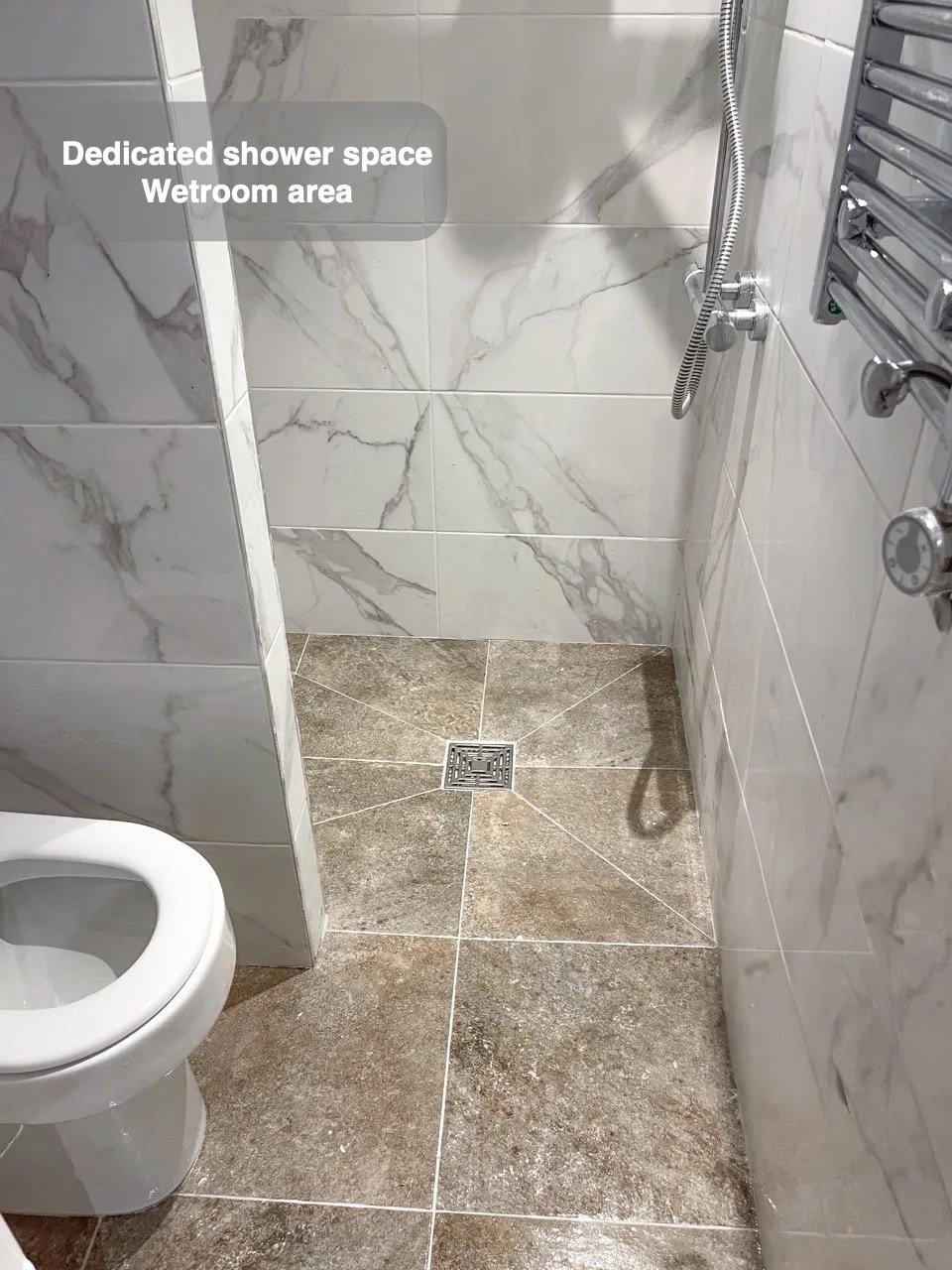 A defined wetroom area in the completed Inverurie bathroom