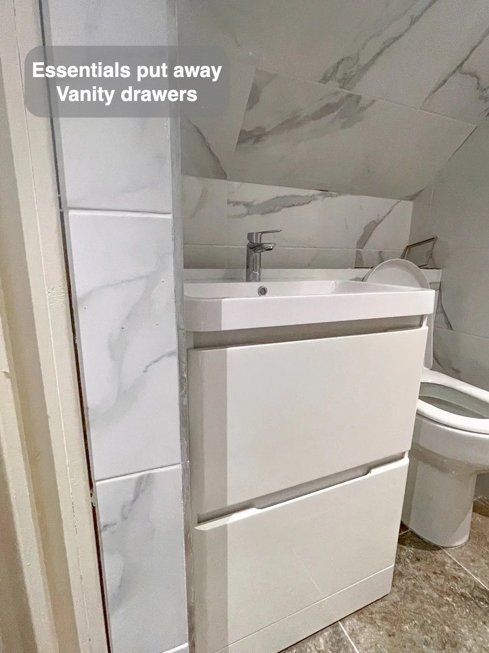 Storage close to the basin in the completed Inverurie bathroom