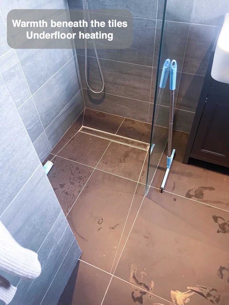 Warmth beneath the tiled floor in Newmacher bathroom