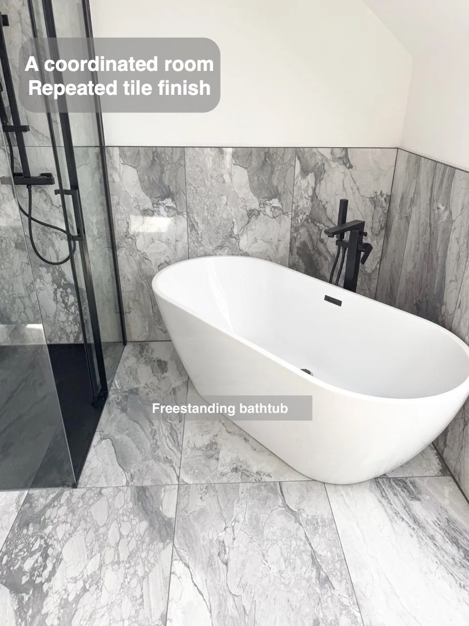 Bath and patterned tiles beside clear shower