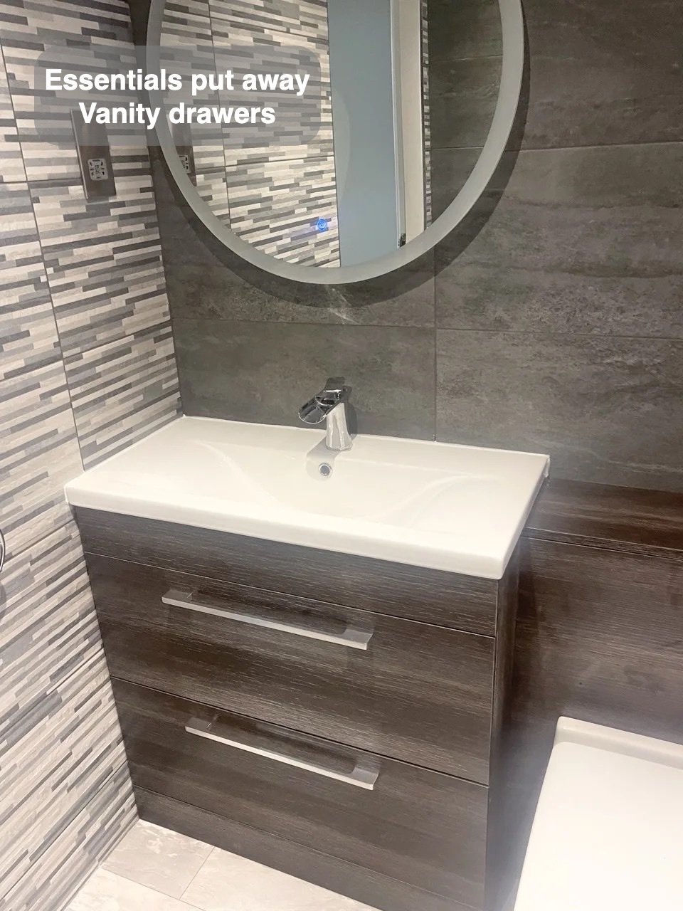 Storage close to the basin in the completed Summerhill, Aberdeen bathroom