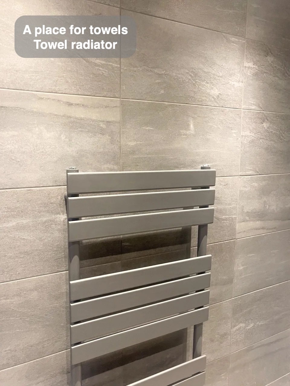 Towels have their own place in the completed Summerhill, Aberdeen bathroom