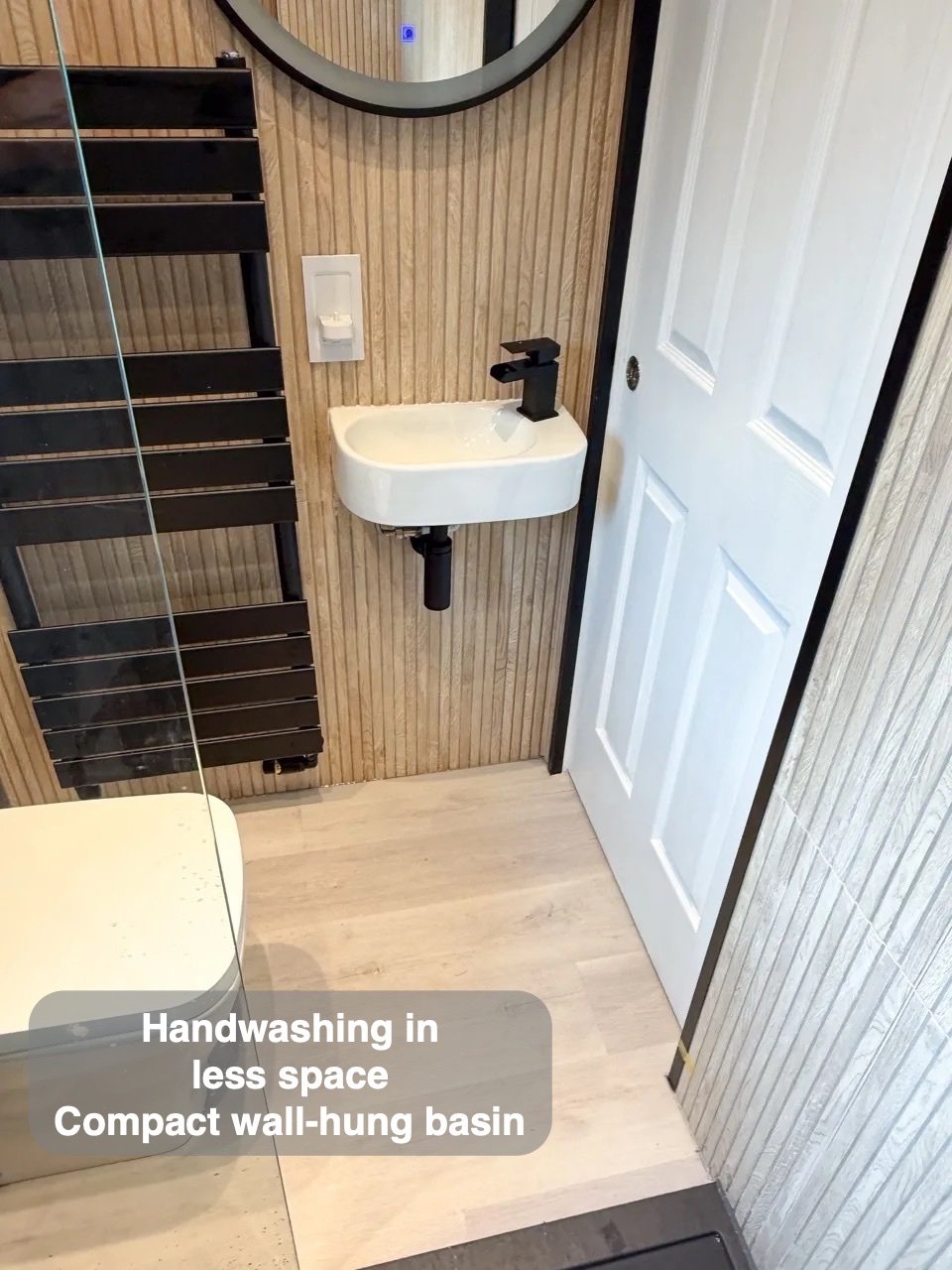 An entrance without a door swing in the completed Ellon bathroom